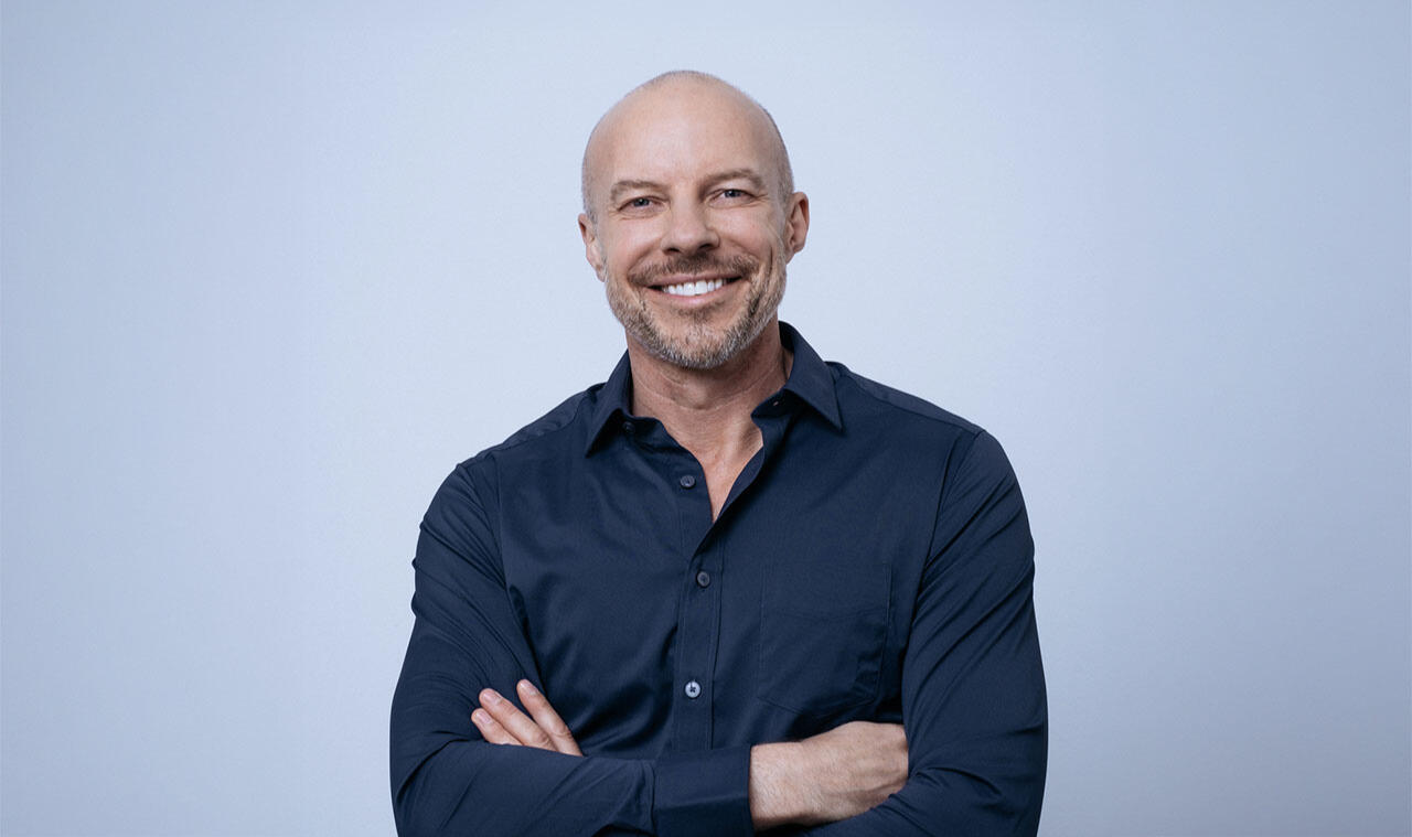 Presenter Gary Williams Presenter Gary Williams looking towards the camera in a blue shirt